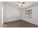 Bright bedroom with vinyl floors, ceiling fan, and a window with blinds at 2388 S Vista Rd, Apache Junction, AZ 85119
