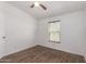 Cozy bedroom with vinyl floors, window with blinds and door to entry hallway at 2388 S Vista Rd, Apache Junction, AZ 85119