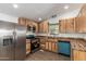 Modern kitchen with stainless steel appliances, wood cabinets, and recessed lighting at 2388 S Vista Rd, Apache Junction, AZ 85119