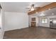 Bright living room features modern flooring and wood beam accents, creating an inviting space at 2388 S Vista Rd, Apache Junction, AZ 85119