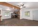Open-concept living area with stainless steel appliances and laminate floors, great for entertaining at 2388 S Vista Rd, Apache Junction, AZ 85119