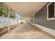 Covered patio with a concrete floor and grey siding that looks out to the backyard at 2388 S Vista Rd, Apache Junction, AZ 85119