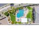 Aerial view of a backyard with a freeform pool, sun loungers, and a covered outdoor living space at 25421 S 228Th St, Queen Creek, AZ 85142