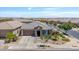 Well-placed home with stone accents, a two-car garage, and low-maintenance front yard landscaping at 25421 S 228Th St, Queen Creek, AZ 85142