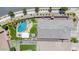 Aerial view of a private backyard oasis with a pool, patio, lush landscaping, and putting green at 25421 S 228Th St, Queen Creek, AZ 85142