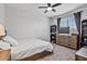 Bedroom with a bed, a ceiling fan, a window, and a dresser with a TV on it at 25421 S 228Th St, Queen Creek, AZ 85142