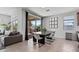 Dining room with a sliding glass door to the backyard, modern furniture, and stylish decor at 25421 S 228Th St, Queen Creek, AZ 85142
