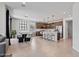 Spacious open floor plan with a kitchen island, a dining table, and modern decor at 25421 S 228Th St, Queen Creek, AZ 85142