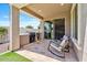 Covered patio with comfortable seating, a built-in grill, and a view of the backyard at 25421 S 228Th St, Queen Creek, AZ 85142