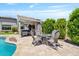 Inviting pool area featuring a pergola with outdoor seating and a cozy fire pit table at 25421 S 228Th St, Queen Creek, AZ 85142