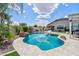 Beautiful backyard with a sparkling pool, lush landscaping, and ample space for relaxation at 25421 S 228Th St, Queen Creek, AZ 85142