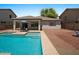 Backyard oasis featuring pool, spa, patio, and serene landscaping at 271 W Roadrunner Dr, Chandler, AZ 85286