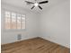 Bright bedroom with light wood flooring, shutters, and neutral walls at 271 W Roadrunner Dr, Chandler, AZ 85286