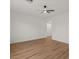 Bright bedroom with light wood flooring, ceiling fan, and neutral walls at 271 W Roadrunner Dr, Chandler, AZ 85286