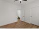 Bright bedroom with wood-look flooring, ceiling fan, and walk-in closet at 271 W Roadrunner Dr, Chandler, AZ 85286