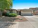 Inviting single-Gathering home featuring a two-car garage and appealing desert landscaping at 271 W Roadrunner Dr, Chandler, AZ 85286