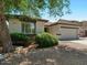 Charming single-story home with a well-manicured front yard and a two-car garage at 271 W Roadrunner Dr, Chandler, AZ 85286