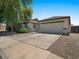 Attractive home with a two-car garage, nice landscaping, and a concrete driveway at 271 W Roadrunner Dr, Chandler, AZ 85286