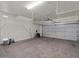 Spacious two-car garage with storage racks and ample room for vehicles at 271 W Roadrunner Dr, Chandler, AZ 85286