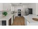 Modern kitchen with white cabinets, granite countertops, stainless steel appliances, and a functional layout at 271 W Roadrunner Dr, Chandler, AZ 85286