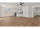 Open-concept living space featuring modern lighting, and attractive wood-look flooring at 271 W Roadrunner Dr, Chandler, AZ 85286