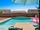 Sparkling inground pool surrounded by desert landscaping and privacy walls at 271 W Roadrunner Dr, Chandler, AZ 85286