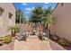 Charming backyard seating area with a fountain, comfortable seating, and mature landscaping at 3152 E San Pedro Ct, Gilbert, AZ 85234
