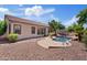 The backyard includes a refreshing pool, and a well-manicured lawn creating a private retreat at 3152 E San Pedro Ct, Gilbert, AZ 85234