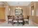 Well-lit dining room featuring chandelier lighting, a wooden dining table and earth-toned walls at 3152 E San Pedro Ct, Gilbert, AZ 85234