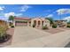 Charming single-Gathering home featuring a tile roof, three-car garage, and manicured desert landscaping at 3152 E San Pedro Ct, Gilbert, AZ 85234
