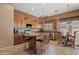 Bright kitchen featuring wooden cabinets, granite countertops, a stainless steel dishwasher and a breakfast nook at 3152 E San Pedro Ct, Gilbert, AZ 85234