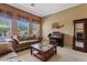 Living room with carpet, many windows, a coffee table, and nice decor at 3152 E San Pedro Ct, Gilbert, AZ 85234