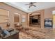Comfortable living room with built-in media center and fireplace at 3152 E San Pedro Ct, Gilbert, AZ 85234
