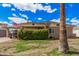 Charming brick home featuring a well-manicured front yard and mature landscaping at 3238 W Altadena Ave, Phoenix, AZ 85029
