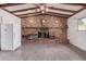 Spacious living area showcasing a brick fireplace and wood beam ceiling at 3238 W Altadena Ave, Phoenix, AZ 85029
