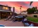 Private backyard featuring a hot tub, lounge area and lush lawn, perfect for entertaining and relaxation at 3377 W Grandview Rd, Phoenix, AZ 85053