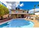 Backyard showcasing a sparkling pool, patio area, and a luxurious hot tub at 3377 W Grandview Rd, Phoenix, AZ 85053