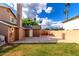 Private backyard showcasing a spacious concrete patio, green lawn, and secure fencing at 3377 W Grandview Rd, Phoenix, AZ 85053