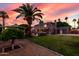 Expansive backyard featuring a lush lawn, mature palm trees, and an inviting outdoor living space at 3377 W Grandview Rd, Phoenix, AZ 85053