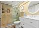 Updated bathroom featuring a tiled walk-in shower, vanity, and modern fixtures at 3377 W Grandview Rd, Phoenix, AZ 85053