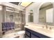 Modern bathroom with gray tile shower, glass door, and updated vanity at 3377 W Grandview Rd, Phoenix, AZ 85053
