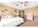 Bedroom featuring a ceiling fan, neutral color scheme, and traditional furnishings at 3377 W Grandview Rd, Phoenix, AZ 85053
