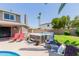 Backyard with a rejuvenating hot tub and comfortable seating, perfect for enjoying warm days and cool nights at 3377 W Grandview Rd, Phoenix, AZ 85053
