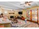 Cozy living room with a fireplace, beamed ceilings, and a comfortable seating area, creating a warm and inviting space at 3377 W Grandview Rd, Phoenix, AZ 85053