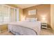 Comfortable bedroom with neutral tones, a large window, and ample natural light at 3377 W Grandview Rd, Phoenix, AZ 85053