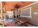Charming patio featuring comfortable seating, ceiling fans, a dining table, and decorative accents for outdoor enjoyment at 3377 W Grandview Rd, Phoenix, AZ 85053