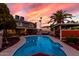 Backyard pool surrounded by lush landscaping and a cozy patio area, perfect for enjoying sunny days and warm evenings at 3377 W Grandview Rd, Phoenix, AZ 85053