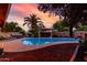 Inviting backyard pool with a relaxing hot tub, lounge area, and lush landscaping at 3377 W Grandview Rd, Phoenix, AZ 85053
