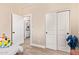 Bright bedroom offering a walk-in closet with white sliding doors at 34834 N Surrey Ln, San Tan Valley, AZ 85140