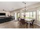 An open-concept layout with a dining area and living room with exterior patio access at 34834 N Surrey Ln, San Tan Valley, AZ 85140